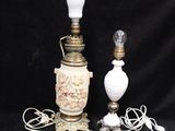 two lamps are sitting next to each other on a black background