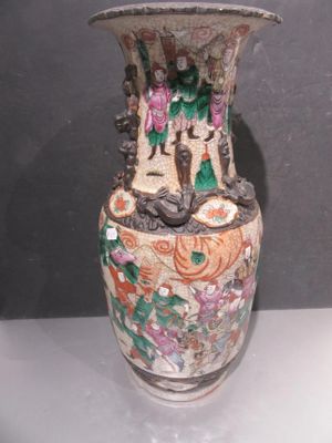 a vase that is sitting on a table in a room