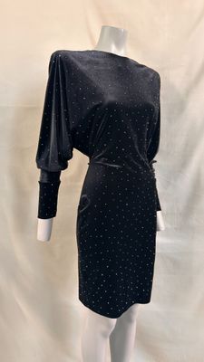 black dress with white polka dots on it on a mannequin mannequin