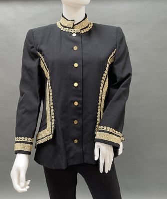 a mannequin wearing a black and gold jacket with gold buttons