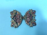 two antique brooches with pink crystals and gold leaves