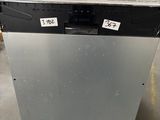 an old dishwasher sitting on a pallet in a warehouse
