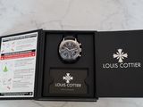 a box with a watch inside of it on a marble surface