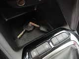a car key in the center console of a car