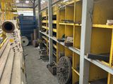 a room with a lot of shelves and shelves with wheels