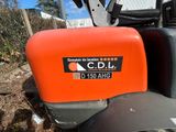 an orange case sitting on the back of a tractor