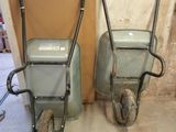 two wheelbarrows sitting next to each other on the floor