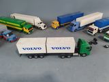 many toy trucks that are lined up together on the table