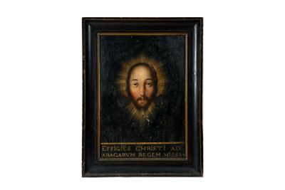 un vieux tableau représentant un homme barbu, dans un cadre noir