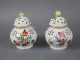 pair of chinese porcelain vases with flowers and birds on them