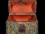 an old wooden box with a lock on the inside of it