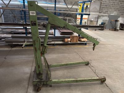 a large green machine that is sitting in a warehouse