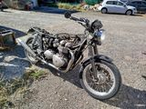a motorcycle that is parked on the side of the road