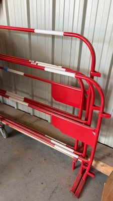 a red bench that is sitting in a garage