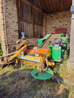 a tractor that is parked next to a building