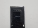 a close up of the back of a black samsung galaxy s10