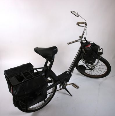 a black bicycle with a basket on the back of it
