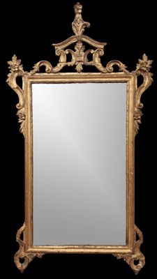 une image représentant un miroir à cadre doré sur fond noir