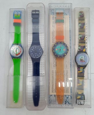 three different watches in the packaging on the table