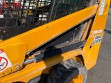 a close up of a yellow ski - door with a no parking sign on it