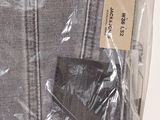 a plastic bag that has a pair of jeans inside of it