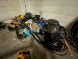 a pile of garbage on the floor of a garage