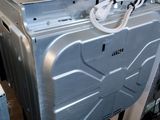 an image of a silver dishwasher in a room