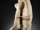 an image of a stone sculpture with a shelf in the middle of it