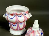 two vases sitting next to each other on a table