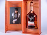 an image of a bottle of whisky in a box with a picture of a woman