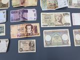 many different types of currency that are on the table