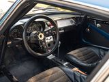 the interior of a car with a steering wheel and dashboard
