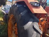 a tractor that is parked on the side of the road