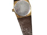 an image of a watch with a brown leather strap and a silver buckle