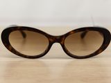 a close up of a pair of sunglasses sitting on a table
