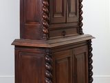 an image of a wooden cabinet with a door on top of it
