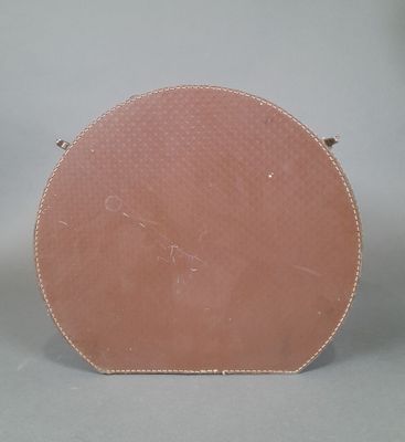 a pink bag sitting on a table with a white background