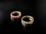 a pair of emerald and pink sapphire rings