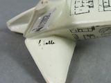 a white origami shaped object with black writing on it