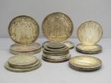 several coins are sitting on top of each other on a table
