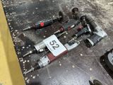 a lot of tools that are sitting on a table