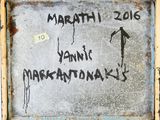 a graffiti on the wall of a building that says marathon 2016