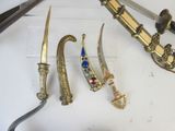 a lot of different types of knives on the table