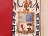 a book with a picture of a coat of arms on it