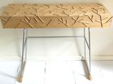a wooden table with sticks on it in a room
