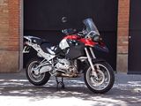 a motorcycle parked in front of a garage door