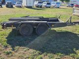 a trailer that is parked in the grass