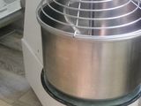 an image of a mixer on the floor in a kitchen