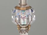 an image of a crystal perfume bottle on a white table