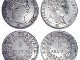 four different types of silver coins on a white background